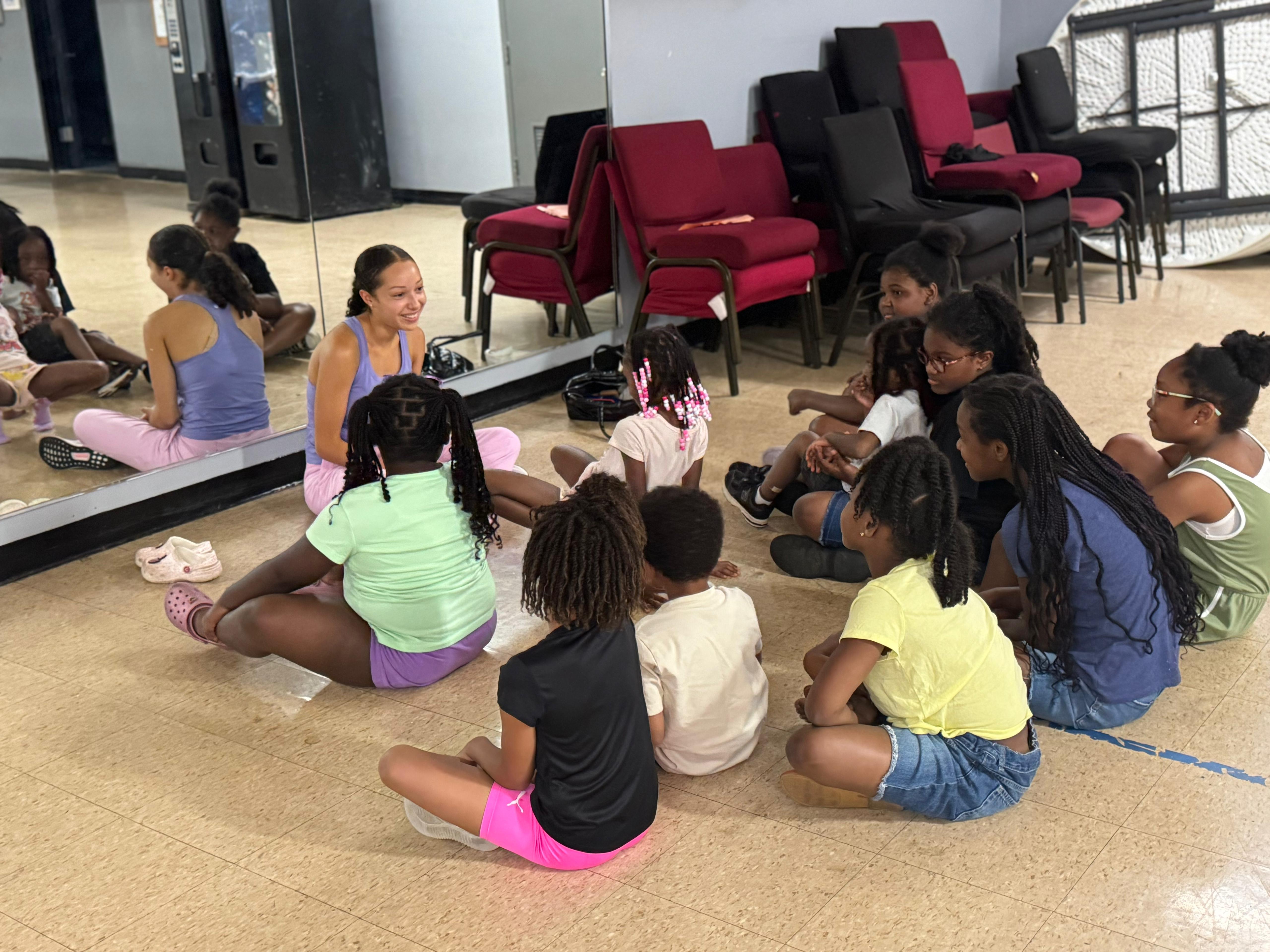 Dance class — our instructor leads a circle discussion before practice