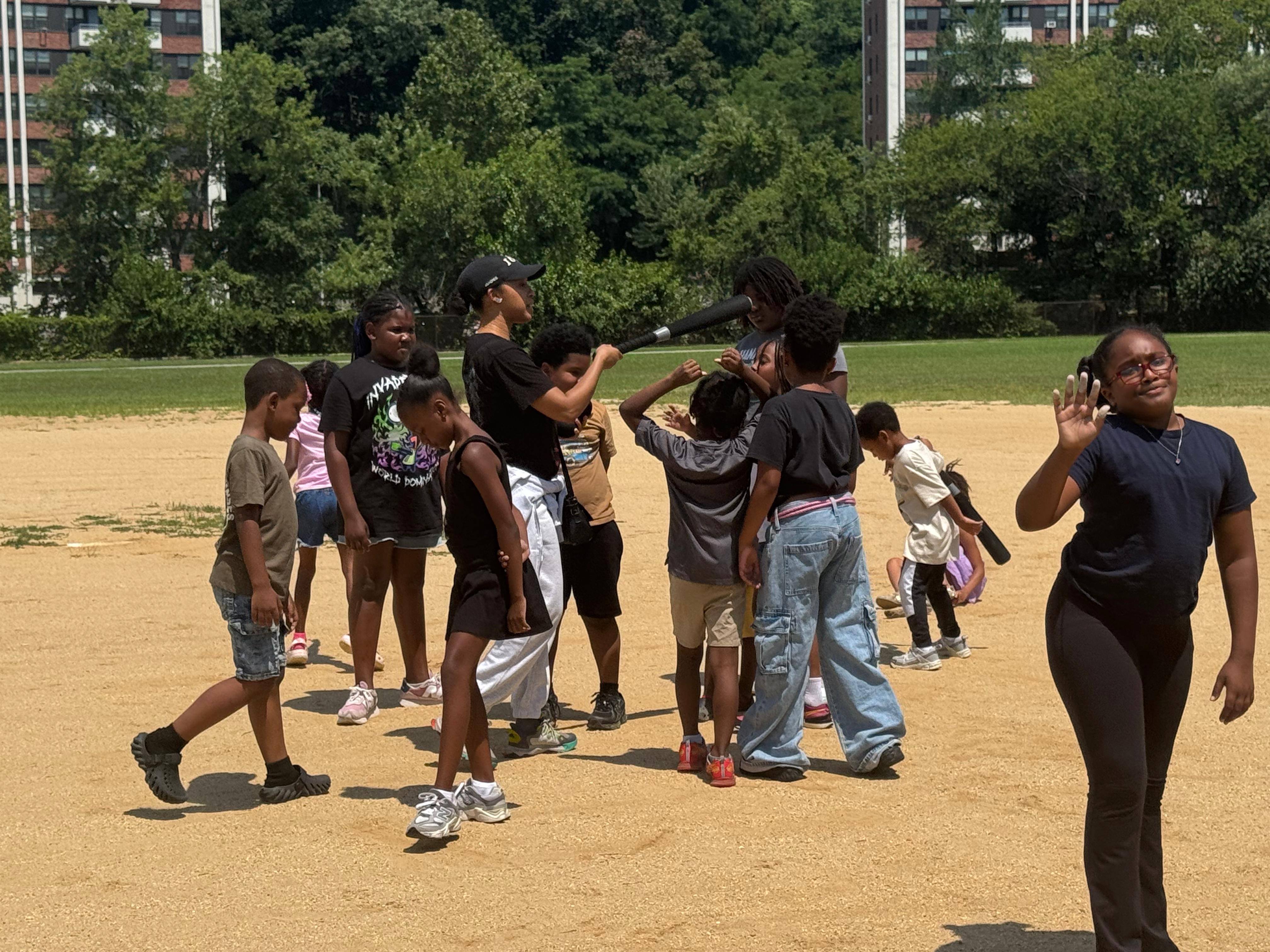 Outdoor sports day — kids play baseball at the park